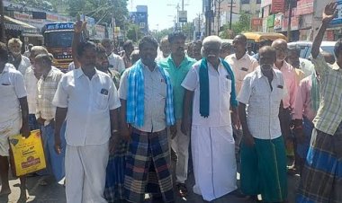 விழுப்புரத்தில் ஒழுங்குமுறை விற்பனைக் கூடத்துக்கு வந்த விளைபொருள்களை ஏலத்தில் எடுக்க வியாபாரிகள் வராததை கண்டித்து சாலை மறியலில் ஈடுபட்ட விவசாயிகள்.